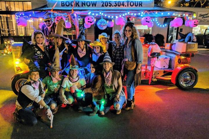 Group of pedal bikers standing next to bike